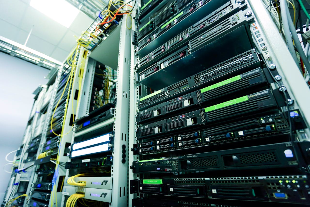 portfolio-06 High-tech server rack in a secure data center with network cables and hardware components.